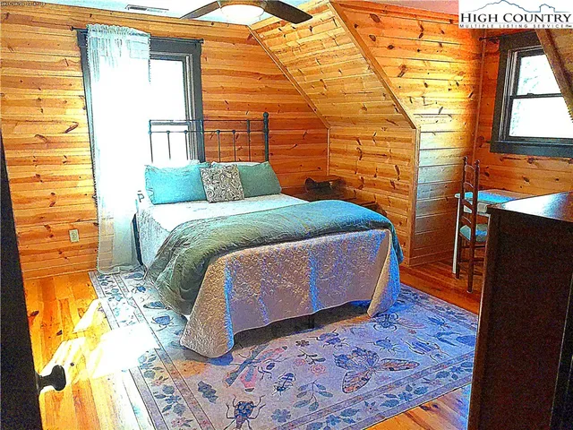 a bedroom with a bed and a table