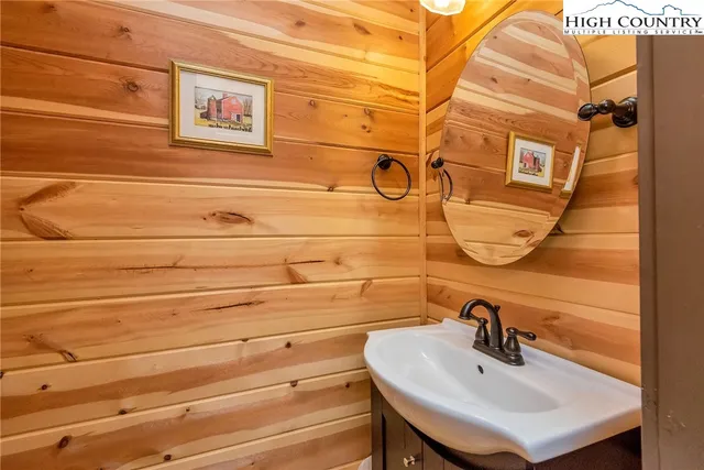 an aerial view of a house with pool yard and outdoor seating