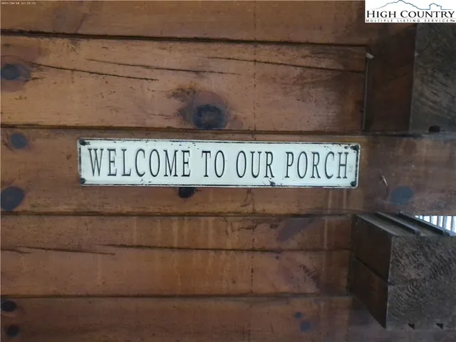 a view of a balcony with wooden floor