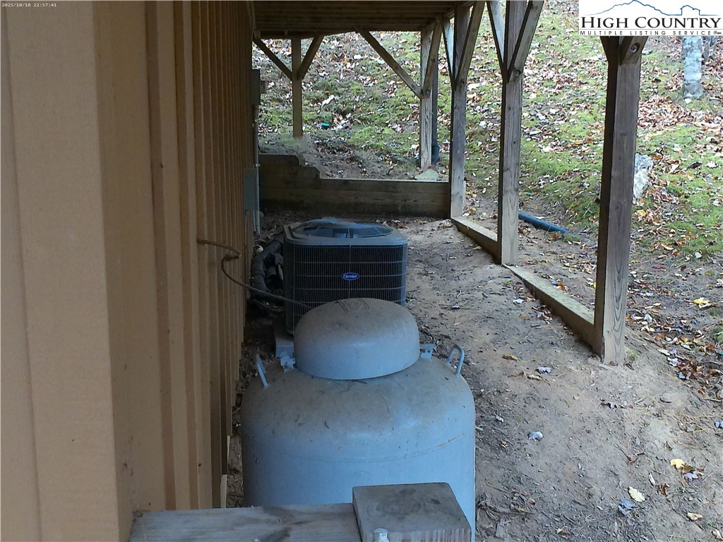 1459 River Front Ridge Drive Jefferson, NC 28640 - Photo 32 of 33 a living room with furniture and a floor to ceiling window