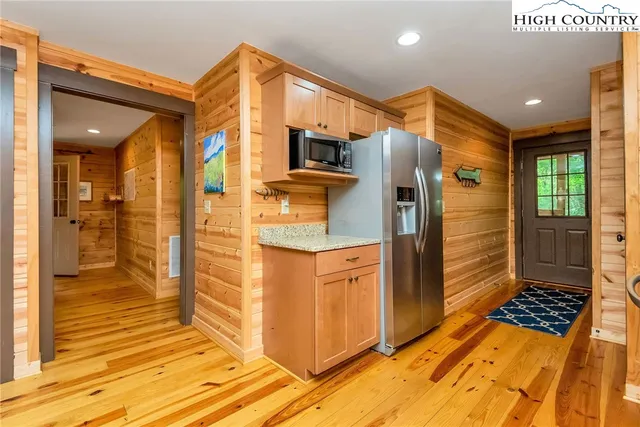 a bathroom with a sink a mirror and shower