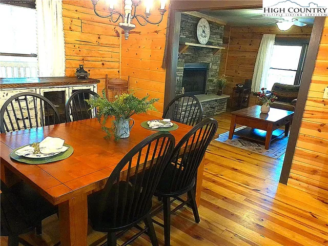 a outdoor dining space with furniture and wooden floor