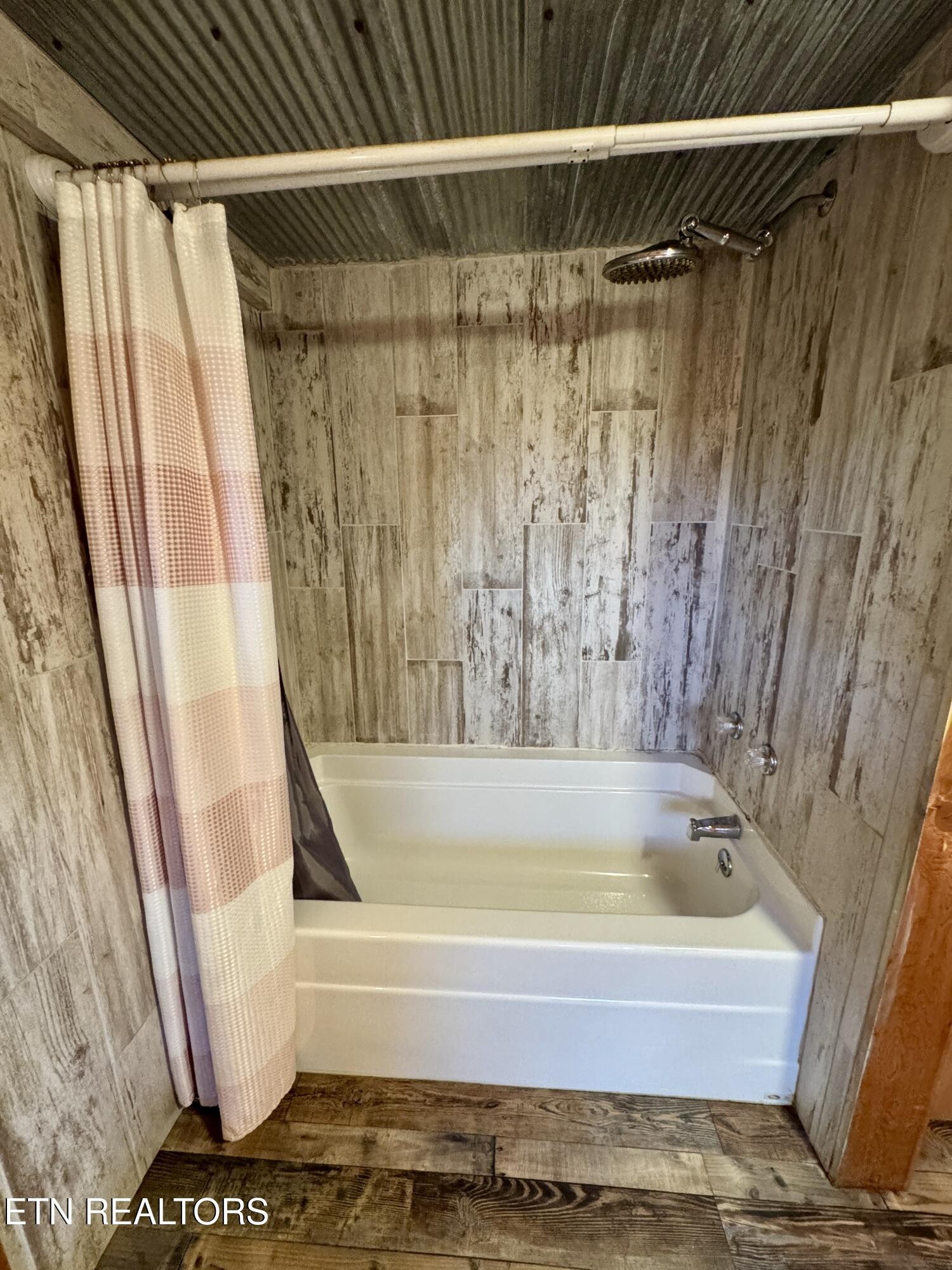 1336 Baldwin Gulf Road Clarkrange, TN 38553 - Photo 22 of 47 a bathroom with a bathtub and shower