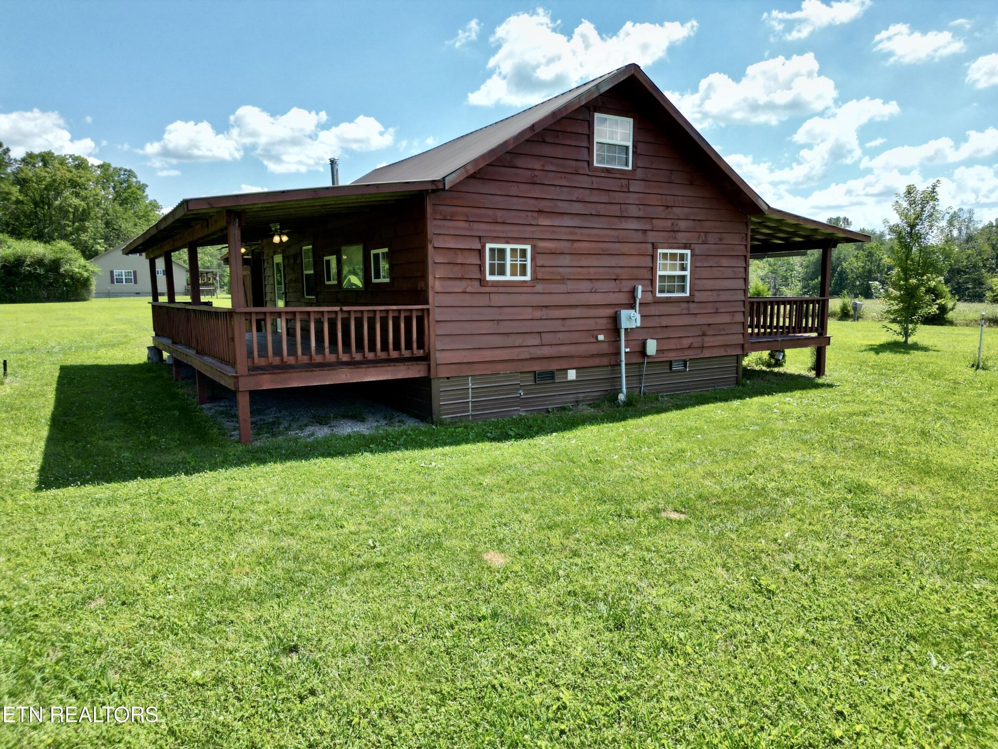 1336 Baldwin Gulf Road Clarkrange, TN 38553 - Photo 32 of 47 a view of a house with a yard and deck