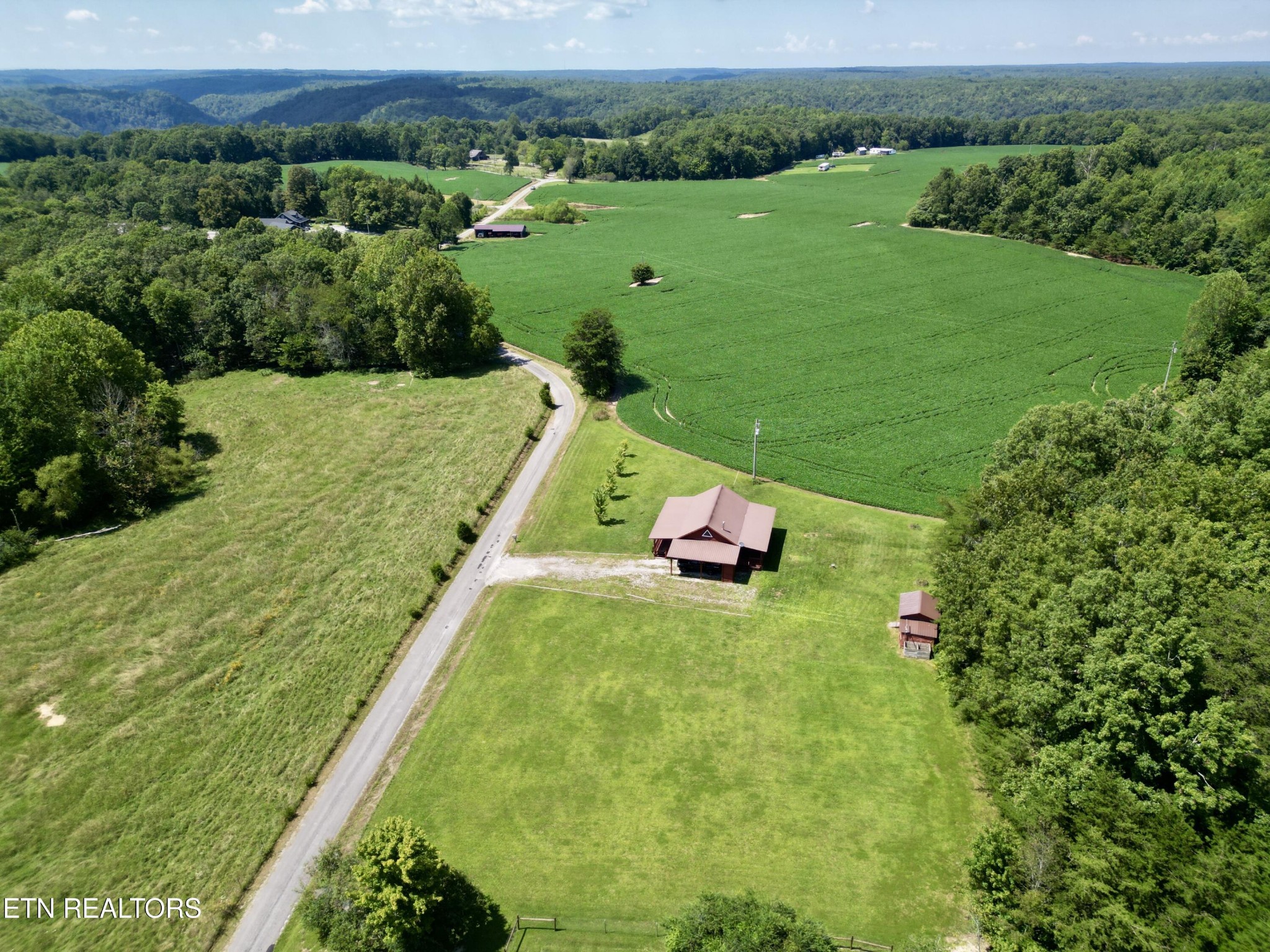 1336 Baldwin Gulf Road Clarkrange, TN 38553 - Photo 39 of 47 a view of a lake with a yard