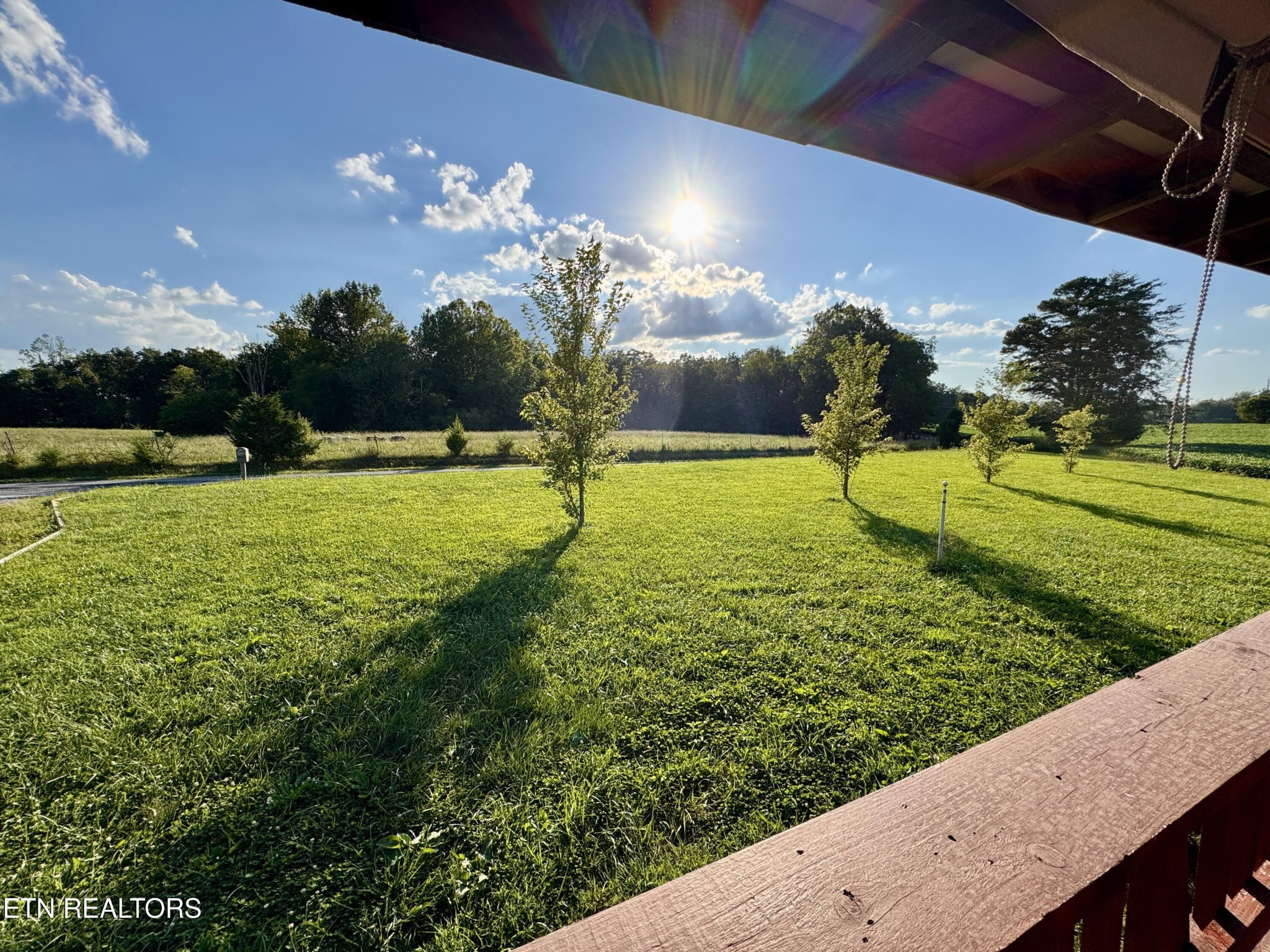 1336 Baldwin Gulf Road Clarkrange, TN 38553 - Photo 5 of 47 a view of a golf ground with a building in the background