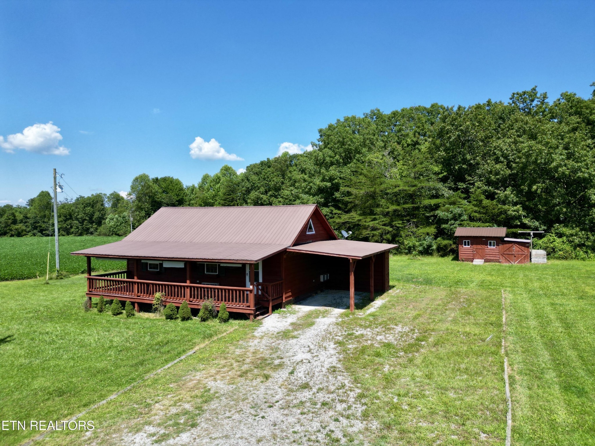 1336 Baldwin Gulf Road Clarkrange, TN 38553 - Photo 7 of 47 a view of a house with a yard balcony and sitting area