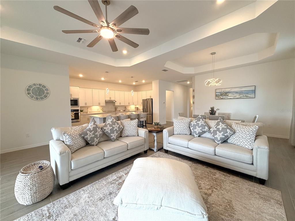 13081 Tulum Loop Venice, FL 34293 - Photo 15 of 48 a living room with furniture and a large window