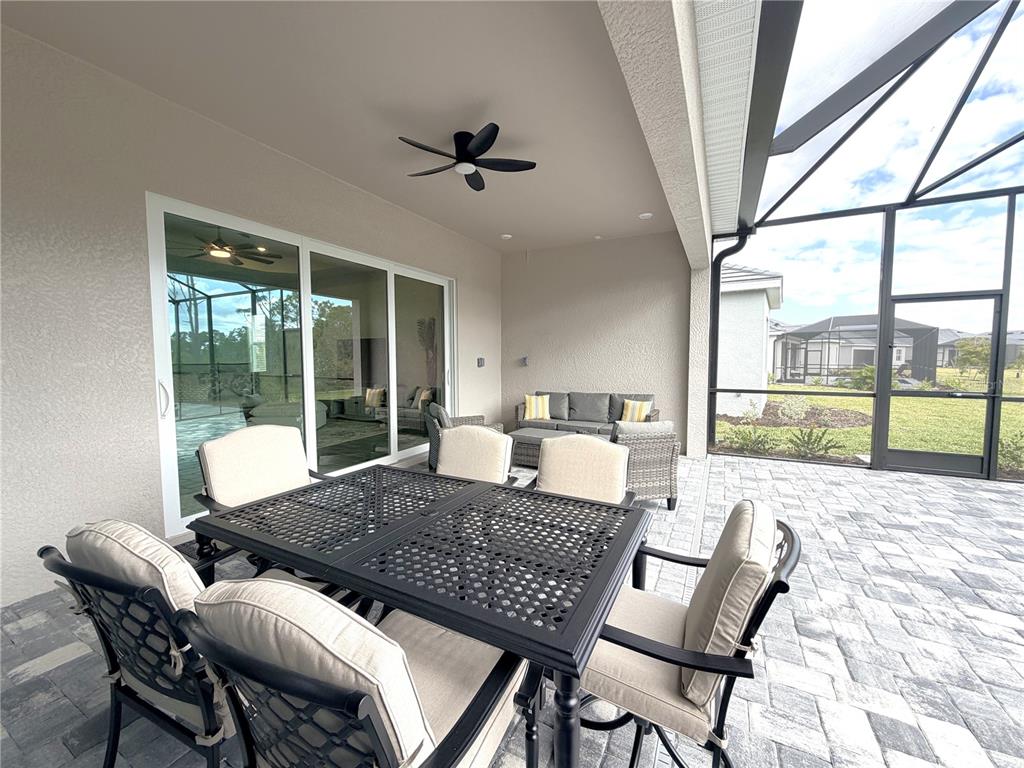 13081 Tulum Loop Venice, FL 34293 - Photo 28 of 48 a living room with furniture and a large window