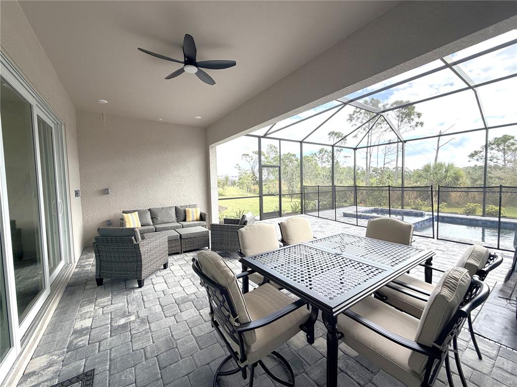 13081 Tulum Loop Venice, FL 34293 - Photo 29 of 48 a living room with furniture and a large window