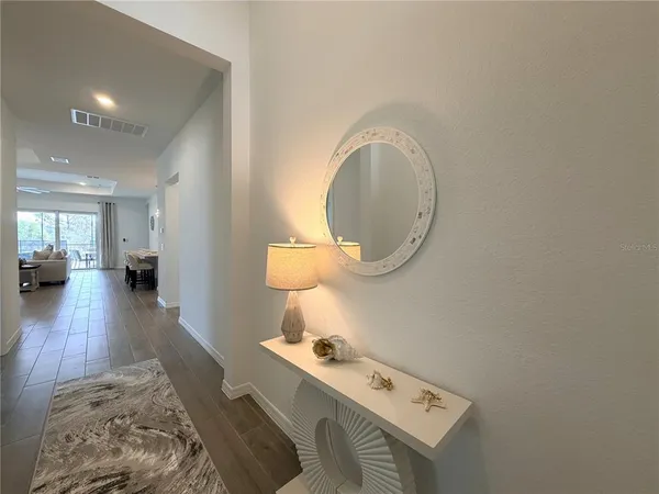 a room with furniture and a wooden floor
