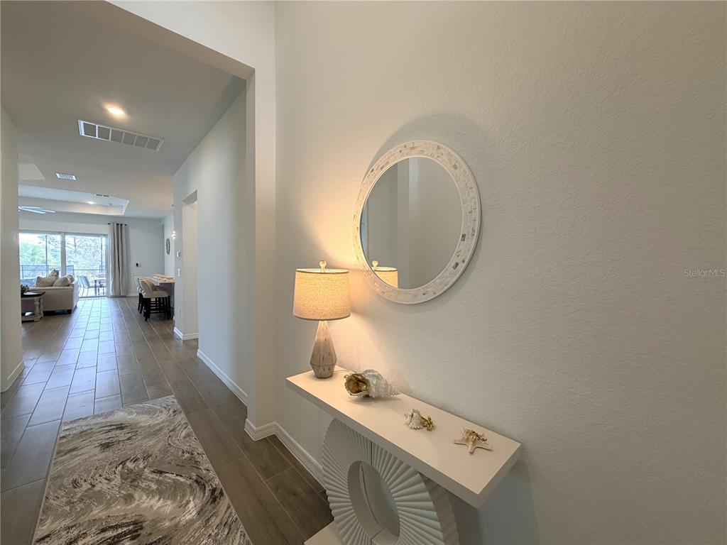 13081 Tulum Loop Venice, FL 34293 - Photo 3 of 48 a room with furniture and a wooden floor