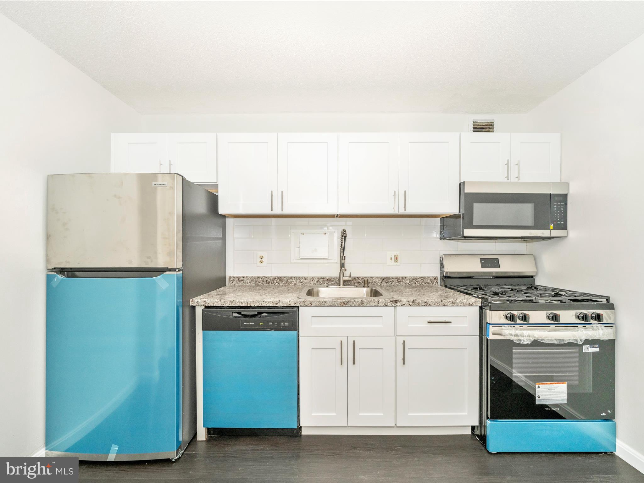 1836 Metzerott Road, Unit 106 Hyattsville, MD 20783 - Photo 12 of 54 a kitchen with stainless steel appliances a stove refrigerator sink and cabinets