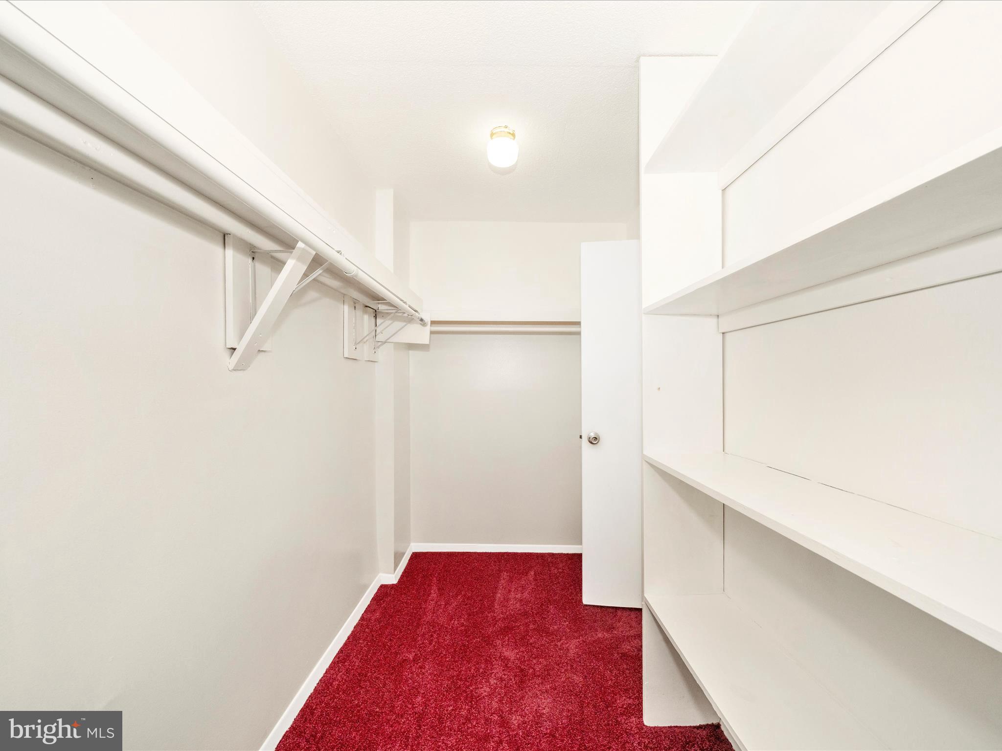 1836 Metzerott Road, Unit 106 Hyattsville, MD 20783 - Photo 29 of 54 a view of hallway with closet and wooden floor