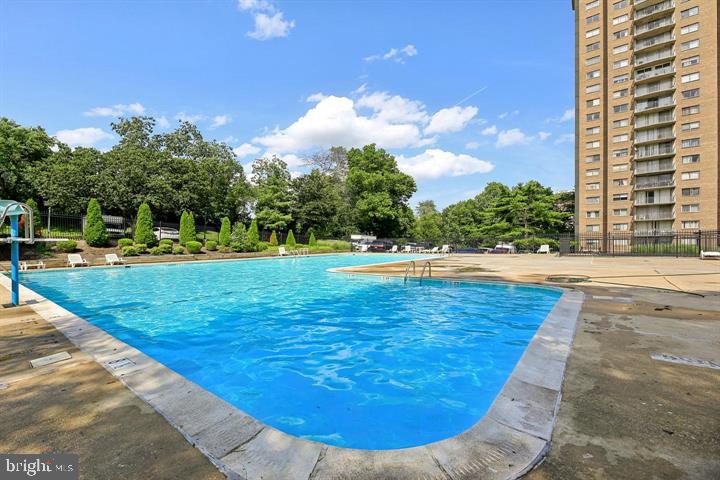 1836 Metzerott Road, Unit 106 Hyattsville, MD 20783 - Photo 3 of 54 a view of a swimming pool with a yard
