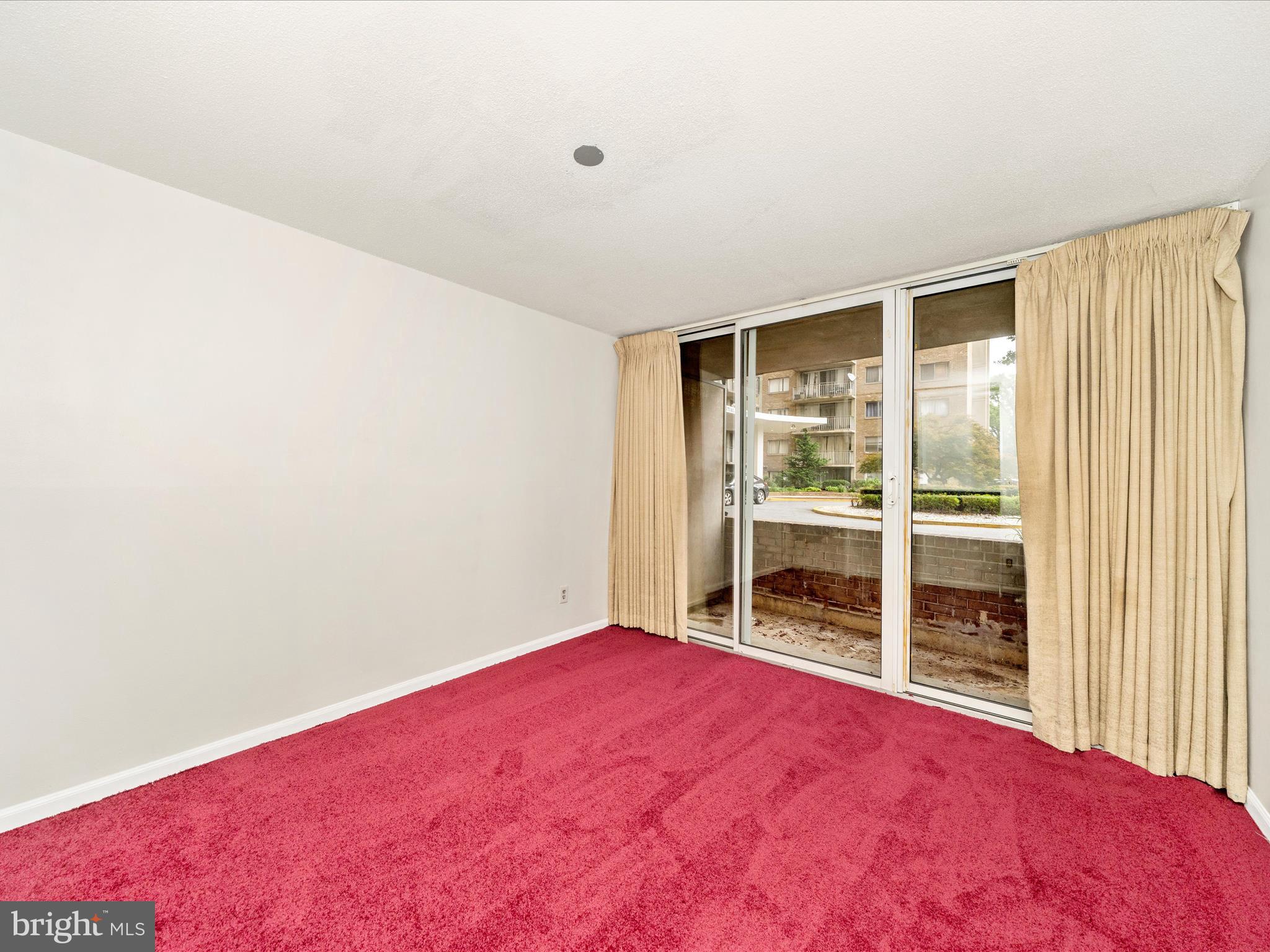 1836 Metzerott Road, Unit 106 Hyattsville, MD 20783 - Photo 34 of 54 an empty room with a window