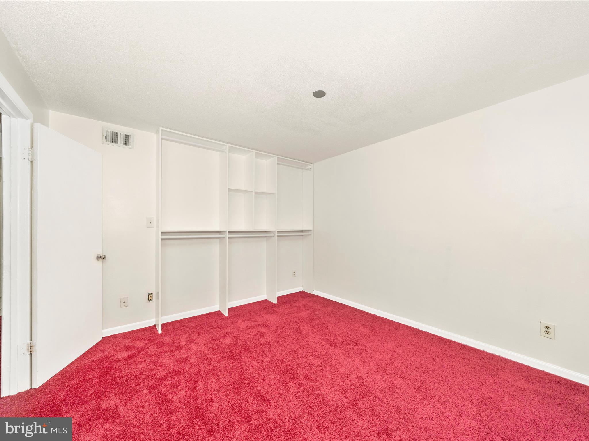 1836 Metzerott Road, Unit 106 Hyattsville, MD 20783 - Photo 37 of 54 a bedroom with a bed and a closet