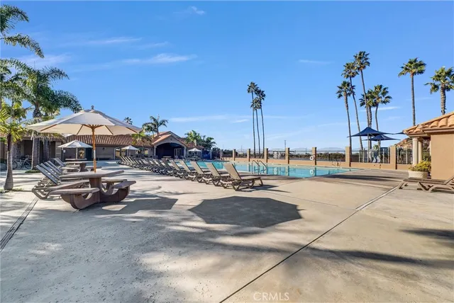 a view of a swimming pool with a patio