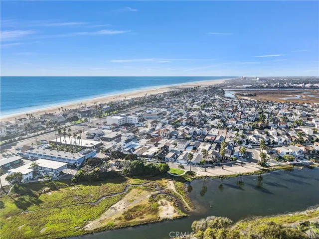 an aerial view of residential building and ocean