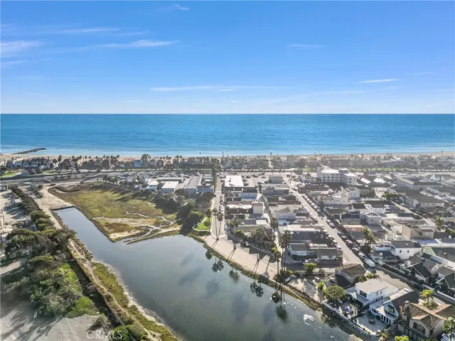 an aerial view of residential building and ocean
