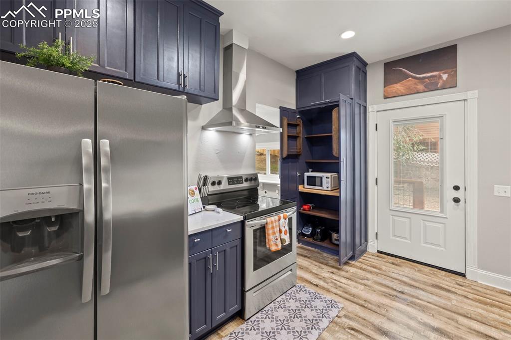 1904 Sheldon Avenue Colorado Springs, CO 80904 - Photo 12 of 40 a kitchen with stainless steel appliances granite countertop a refrigerator and a sink