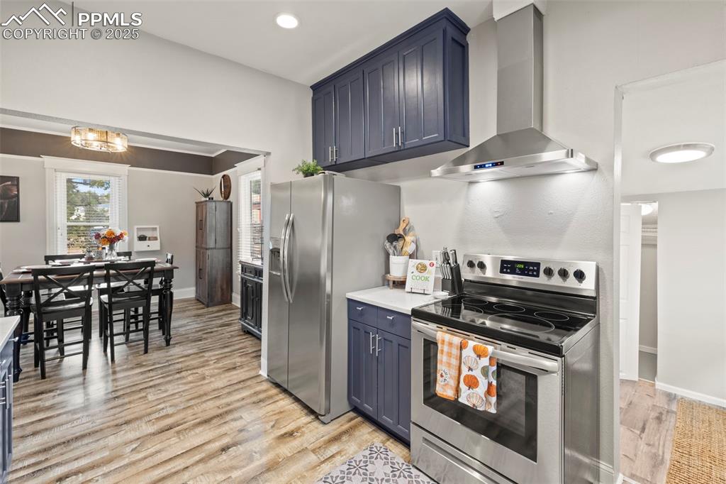1904 Sheldon Avenue Colorado Springs, CO 80904 - Photo 14 of 40 a kitchen with granite countertop a stove a sink and a refrigerator