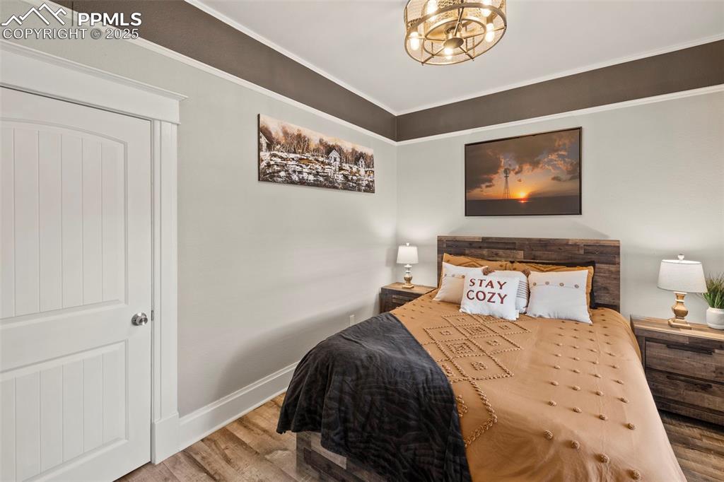 1904 Sheldon Avenue Colorado Springs, CO 80904 - Photo 17 of 40 a bedroom with bed and painting on the wall