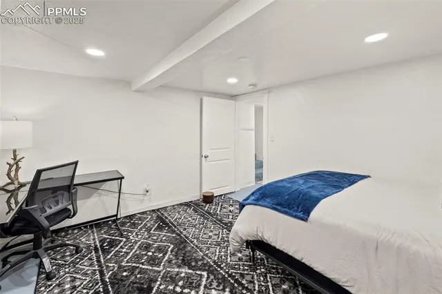 a bedroom with a bed and cabinets