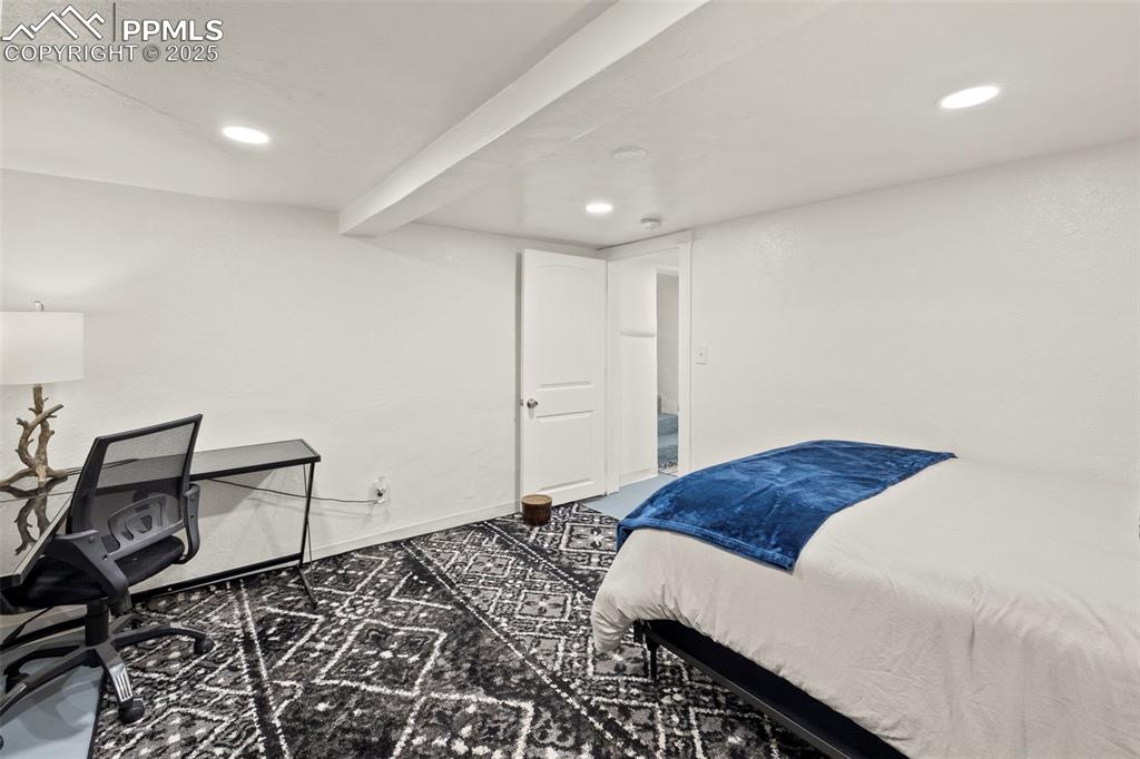 1904 Sheldon Avenue Colorado Springs, CO 80904 - Photo 23 of 40 a bedroom with a bed and cabinets