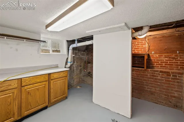a bathroom with a shower and a sink