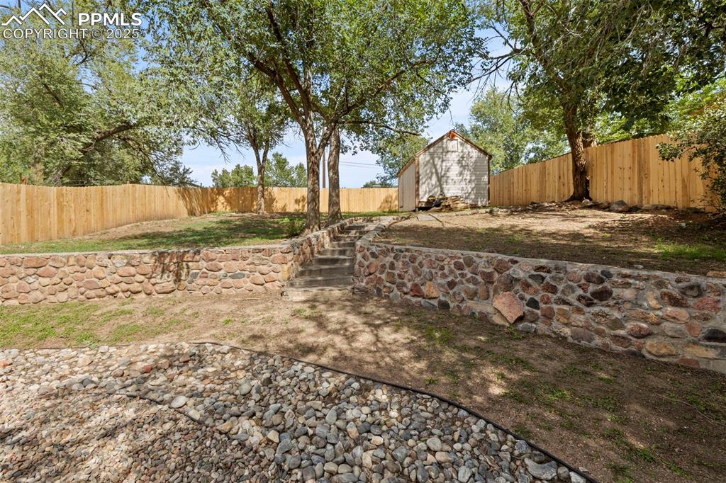 1904 Sheldon Avenue Colorado Springs, CO 80904 - Photo 33 of 40 a view of a backyard with wooden fence