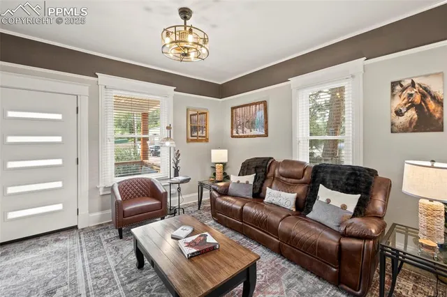 a living room with furniture and a window