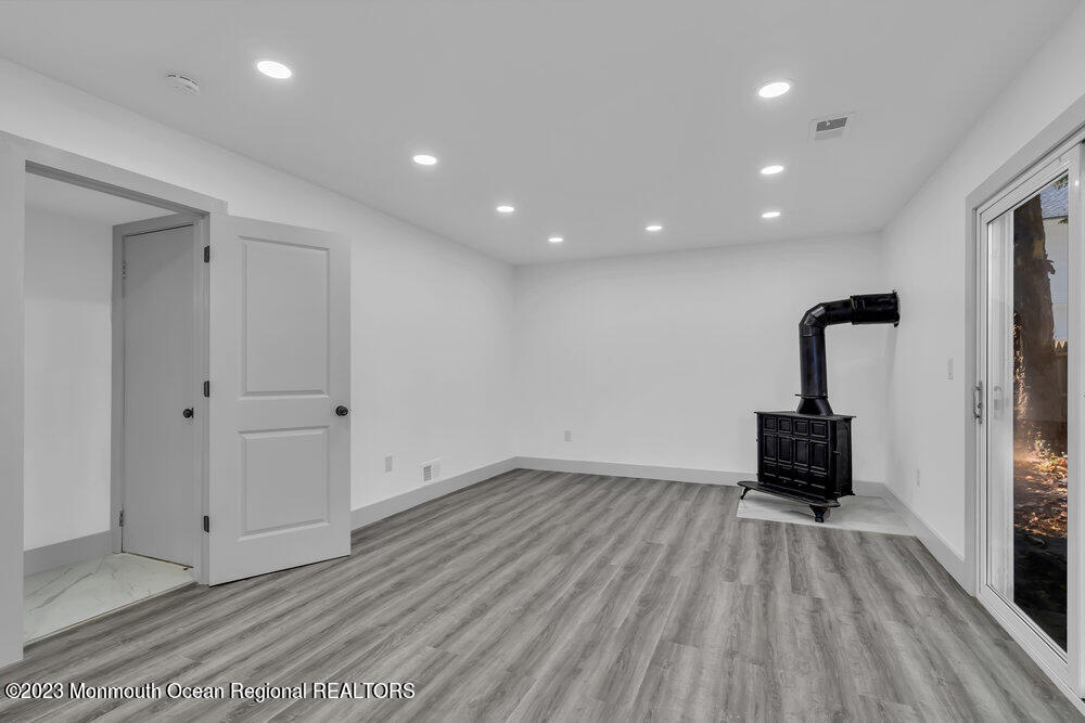 111 Sun Valley Road Toms River, NJ 08755 - Photo 11 of 51 a view of a room with wooden floor