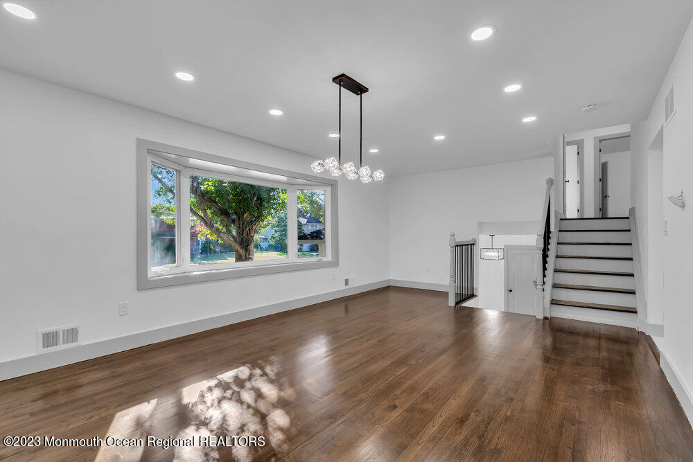111 Sun Valley Road Toms River, NJ 08755 - Photo 24 of 51 a view of empty room with wooden floor and fan