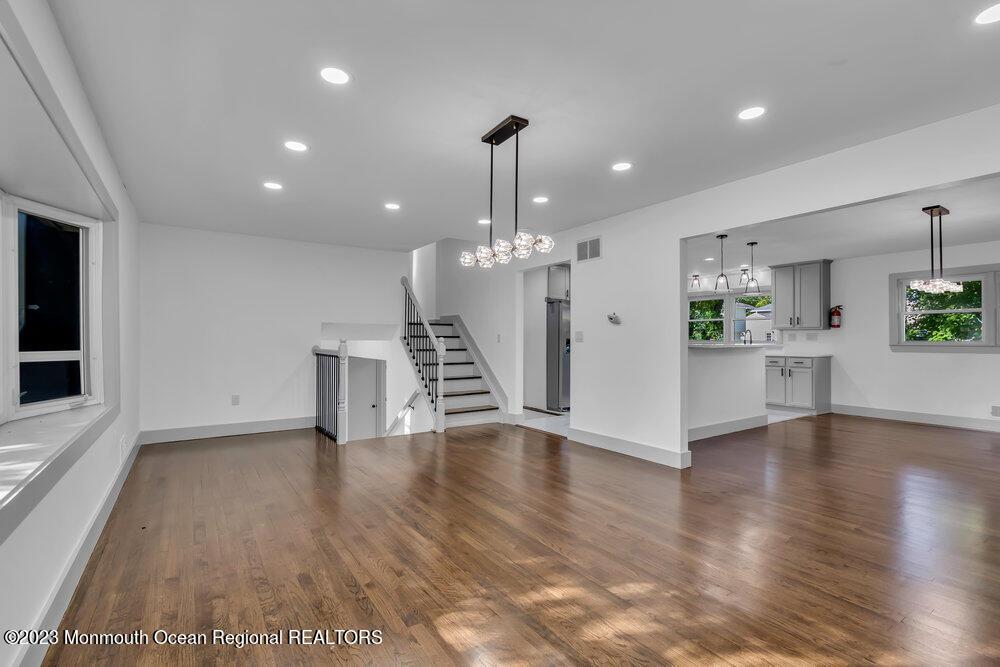 111 Sun Valley Road Toms River, NJ 08755 - Photo 30 of 51 a view of a kitchen with a stove wooden floor and a kitchen