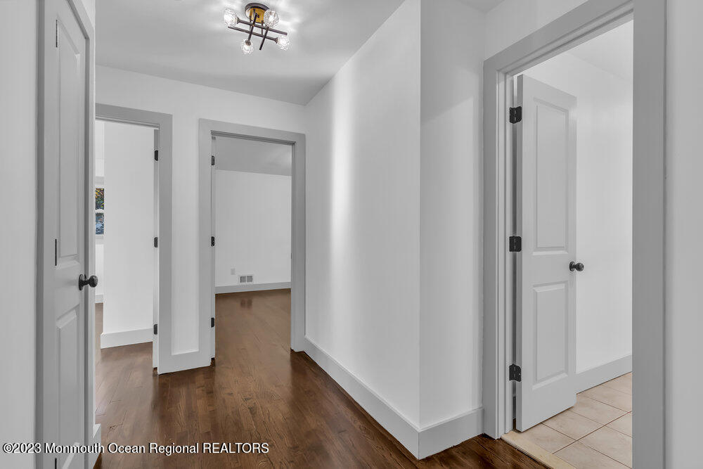 111 Sun Valley Road Toms River, NJ 08755 - Photo 32 of 51 a view of a hallway with wooden floor