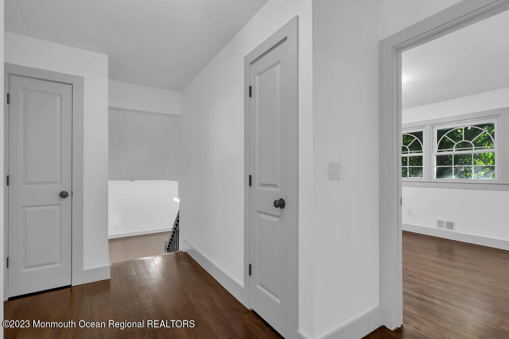 111 Sun Valley Road Toms River, NJ 08755 - Photo 33 of 51 a view of a hallway with wooden floor and closet