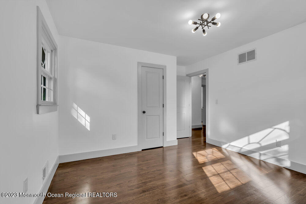 111 Sun Valley Road Toms River, NJ 08755 - Photo 41 of 51 a view of livingroom with hardwood floor and hallway
