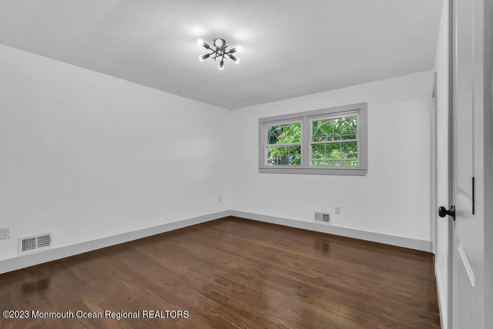 111 Sun Valley Road Toms River, NJ 08755 - Photo 43 of 51 an empty room with a window