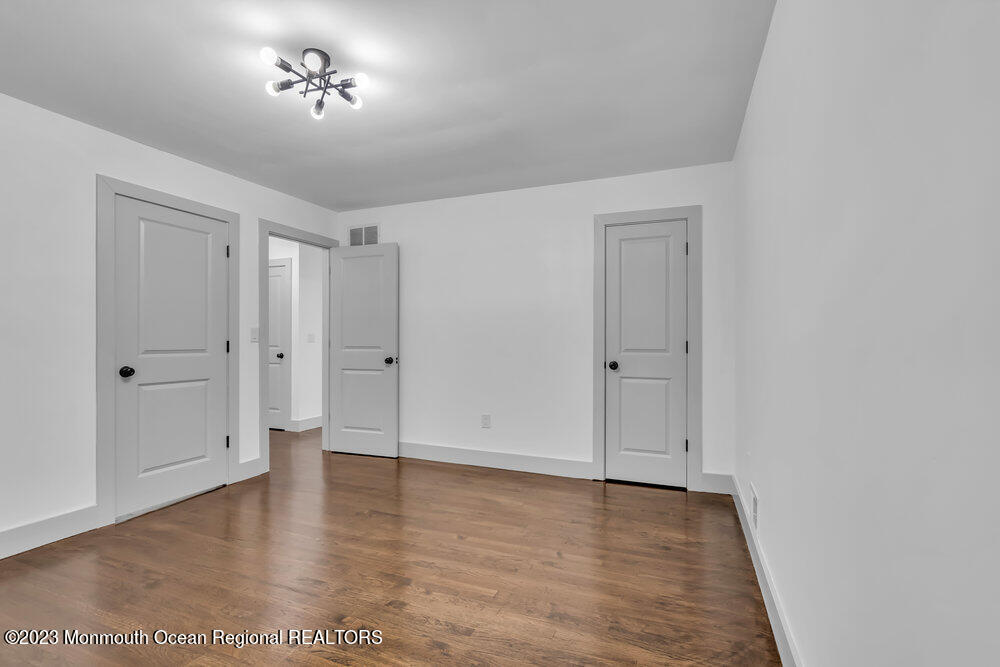 111 Sun Valley Road Toms River, NJ 08755 - Photo 44 of 51 a view of room with a ceiling fan and hardwood floor