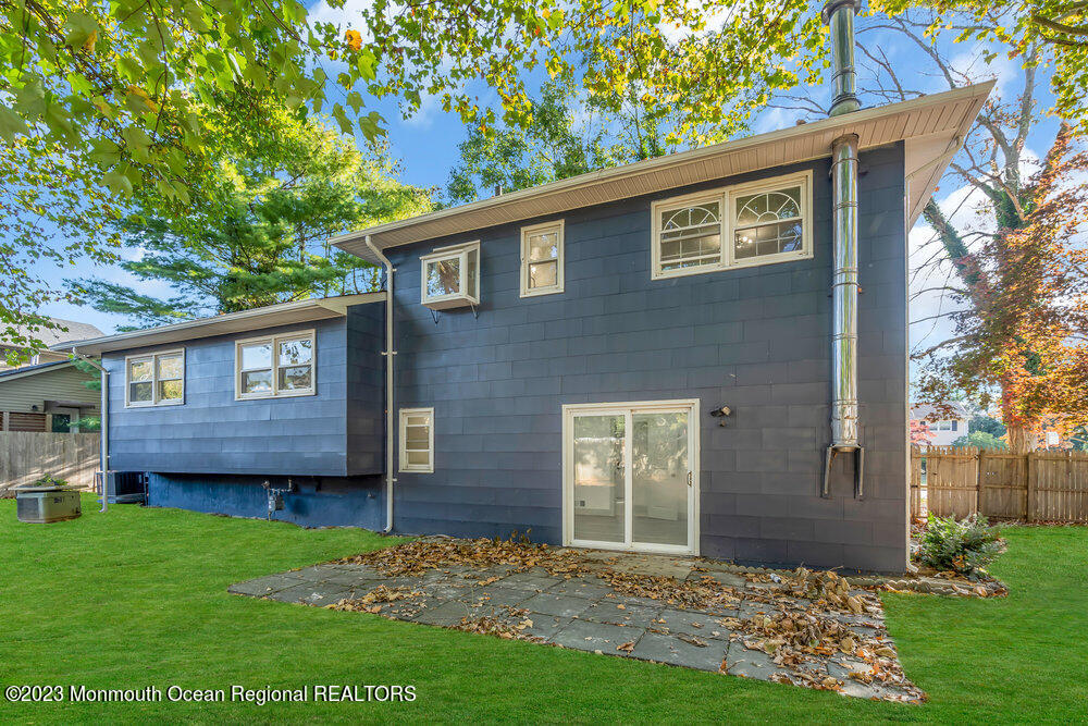 111 Sun Valley Road Toms River, NJ 08755 - Photo 48 of 51 a view of a yard in front of a house with a large tree