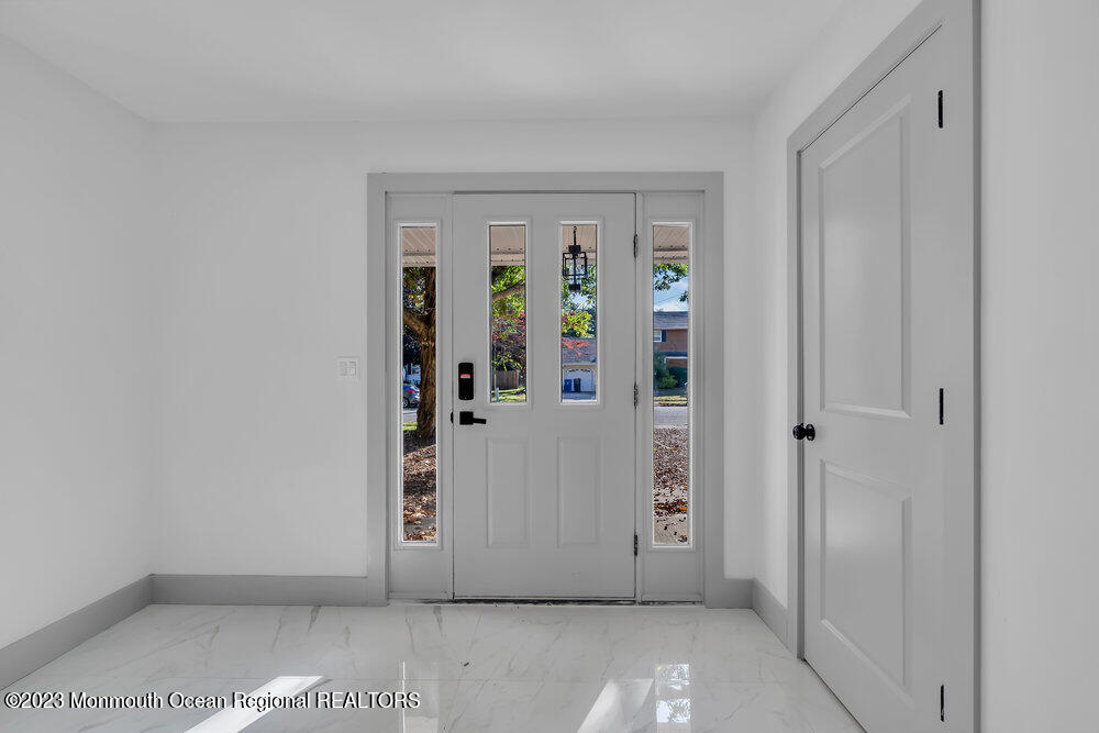 111 Sun Valley Road Toms River, NJ 08755 - Photo 5 of 51 an empty room with windows