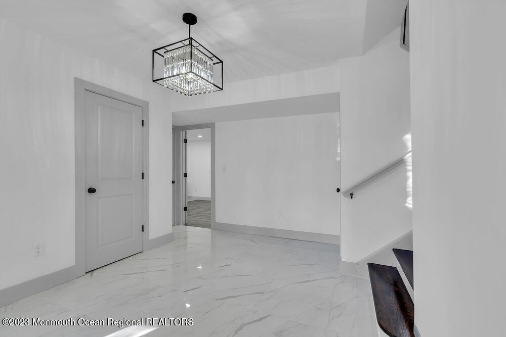 111 Sun Valley Road Toms River, NJ 08755 - Photo 8 of 51 a view of an entryway with a chandelier