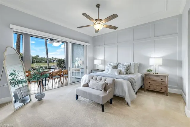 a spacious bedroom with a bed and a large window