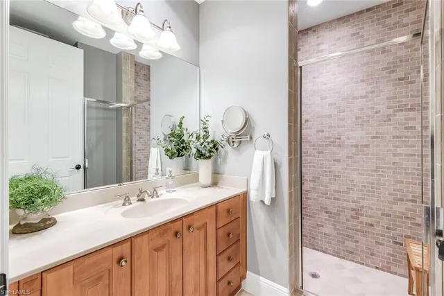 a bathroom with a sink a vanity and a mirror