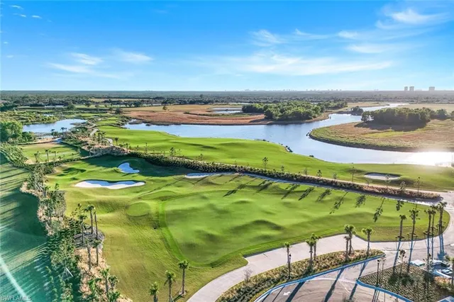 a view of swimming pool with a table and chairs in the patio