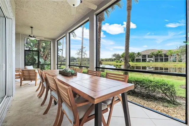 a view of a city from a dining room with large windows