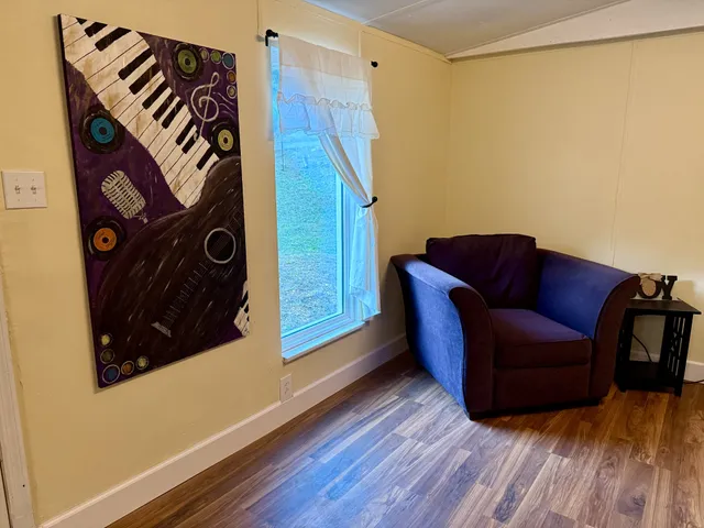 a view of livingroom with furniture and wooden floor