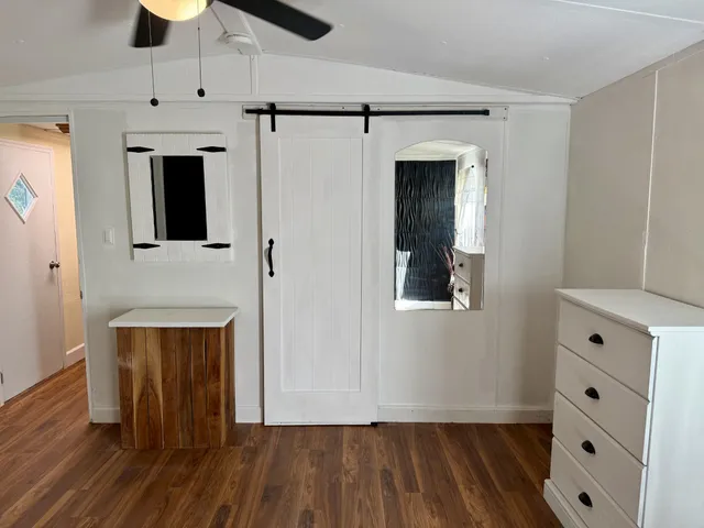 a view of an entryway with a hallway