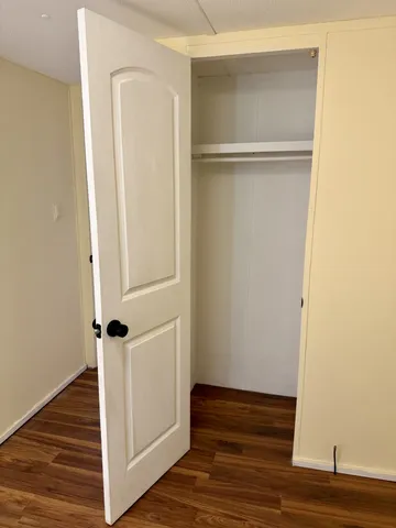 a view of front door with wooden floor